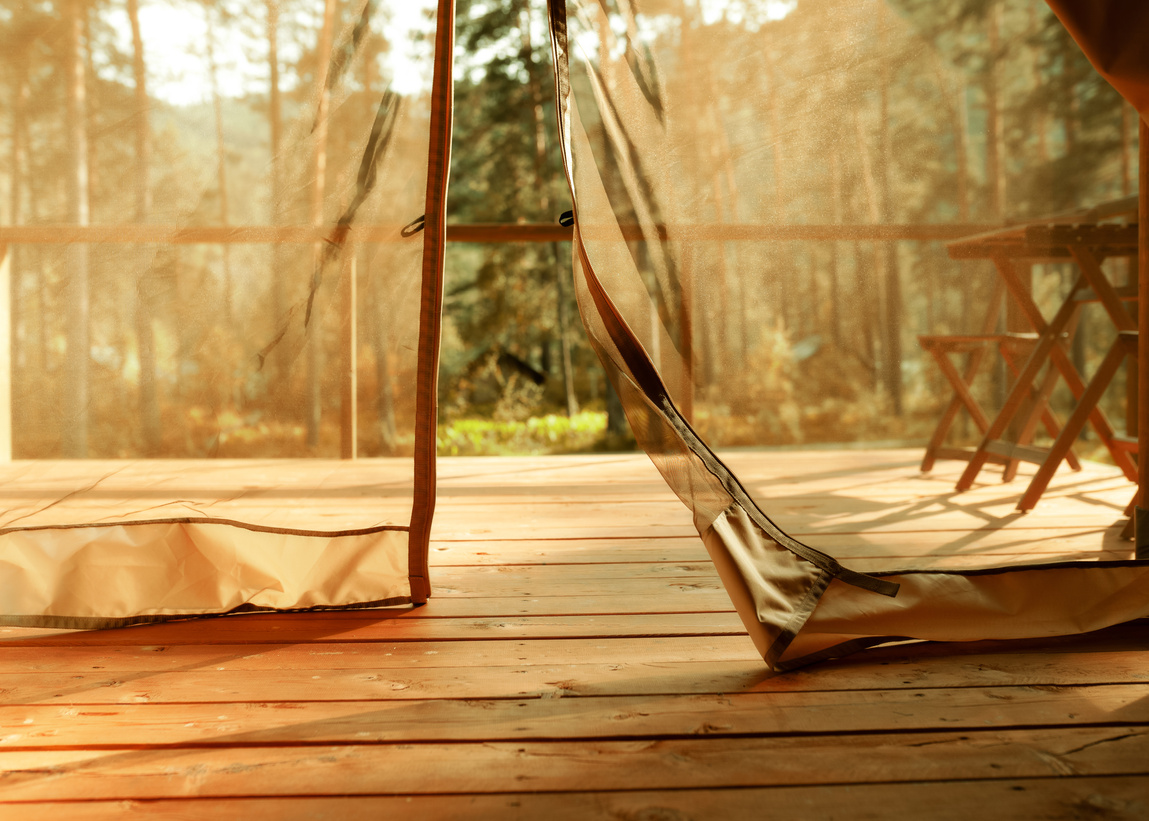 a view of the inside of a tent on a wooden floor